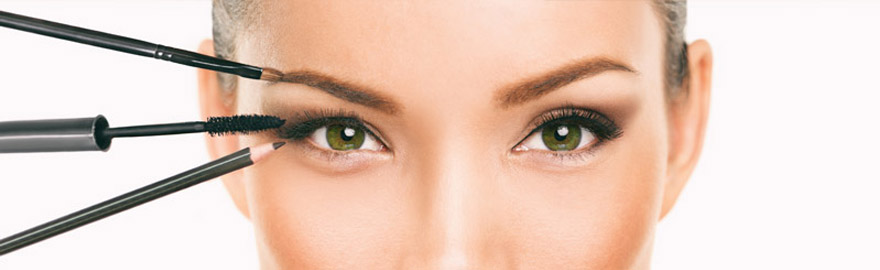 Woman applying eye makeup